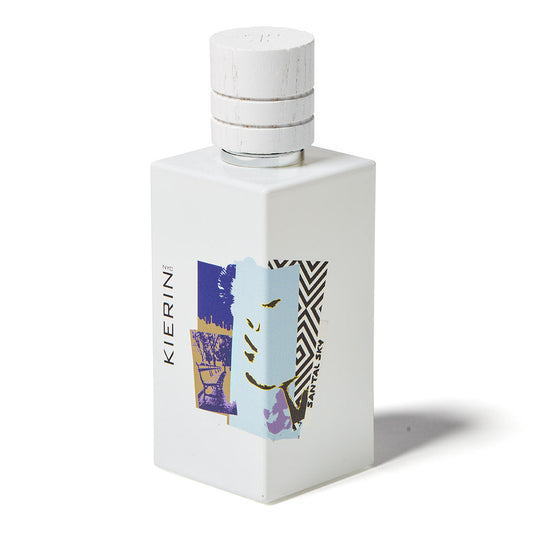 A white rectangular bottle with a white cap, featuring abstract blue, purple, yellow, and black art. "KIERIN" is on the side and "SANTAL SKY" on the front. Santal Sky Eau de Parfum by Kierin is a woody sandalwood-inspired fragrance.