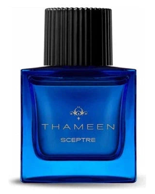 A blue glass bottle with "Sceptre Extrait de Parfum - Thameen London" in gold script from Fragrapedia Haus, inspired by the Sovereign’s Sceptre, features a tall black ribbed cap and offers an ambery scent laced with myrrh.