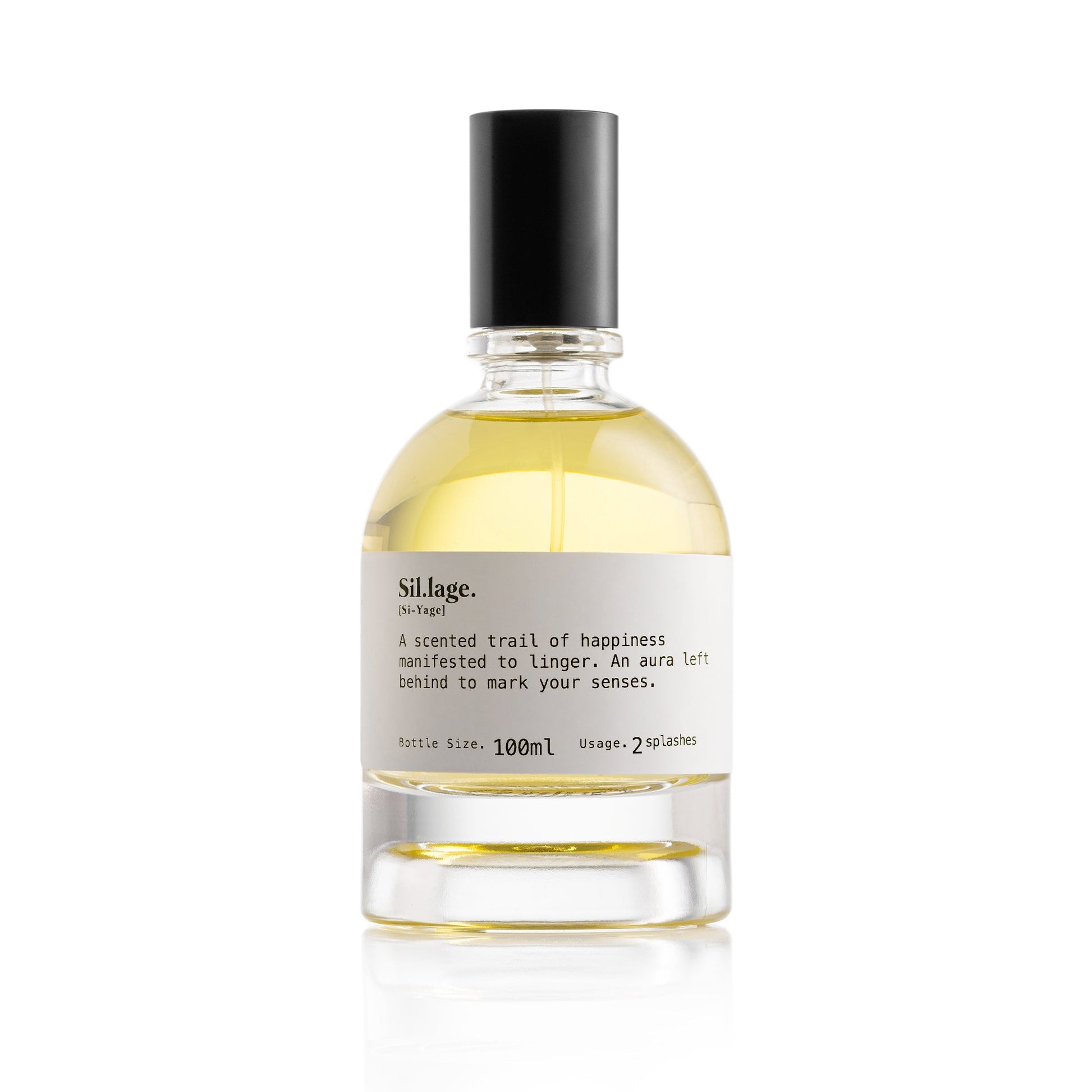 A clear glass perfume bottle with a black cap contains Sil.lage. Eau de Parfum by Scentologia, an amber fragrance in 100ml size. The label displays the product name along with usage instructions and a scent description.