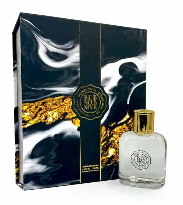 The Submissive Eau de Parfum bottle by Submissive Perfume stands before its black, white, and gold marble box with a gold-edged emblem—reflecting the floral jasmine notes of this captivating fragrance.