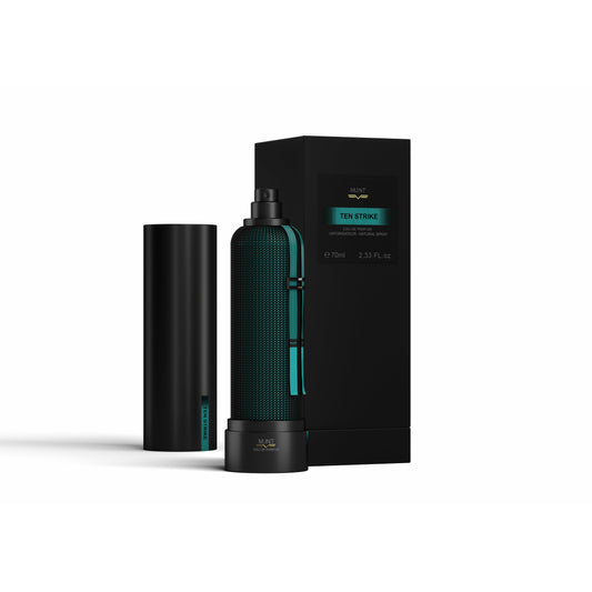A sleek black bottle with teal accents labeled Ten Strike Eau de Parfum by M.INT stands beside a matching cap and black rectangular box, both highlighting the scent’s Oriental Fougere and patchouli notes.