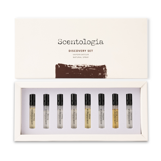 An open box labeled "Discovery Set 9x2ML - Scentologia" displays nine sample perfume vials neatly arranged in a white foam insert, inviting you to discover the unique scents by Scentologia.