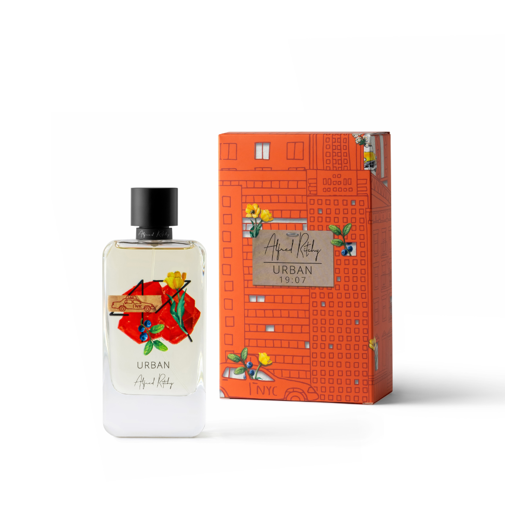 A bottle of URBAN Eau de Parfum by Alfred Ritchy, featuring a vibrant floral design, stands beside an orange box adorned with building and floral illustrations, reflecting the fresh bergamot scent of this modern men's fragrance.