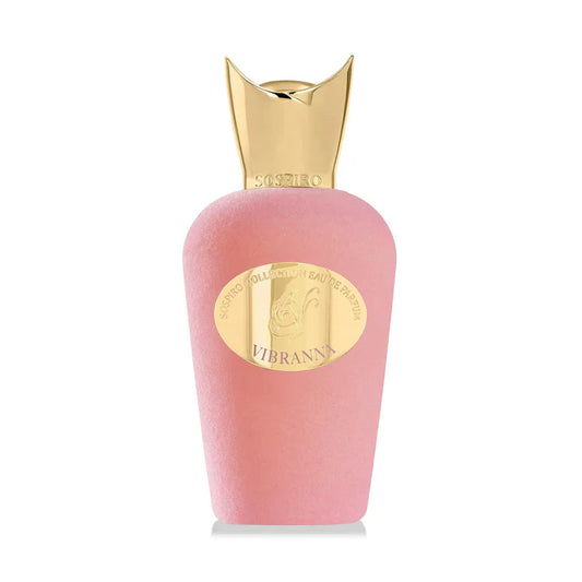 A pink SOSPIRO Vibranna Eau de Parfum bottle for women features a gold sculpted cap, an oval gold label reading "Vibrant," and a matte finish reflecting the powdery luminosity of its signature fragrance.