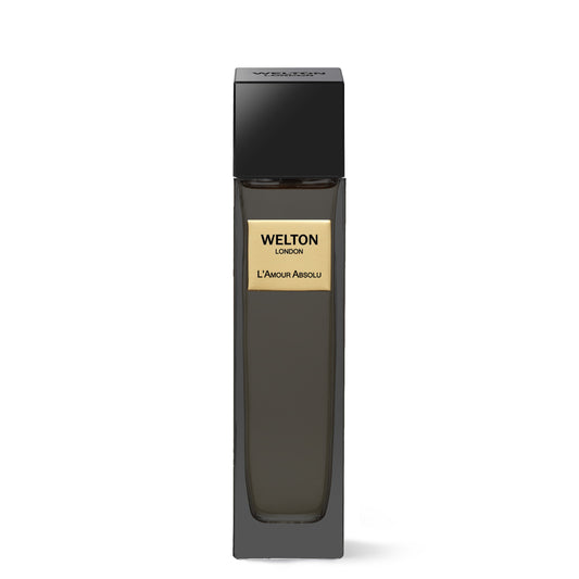 A tall, rectangular dark glass bottle with a black cap and gold label displays “Welton L'Amour Absolu EDP.” This luxury Welton fragrance stands out against a plain white background.