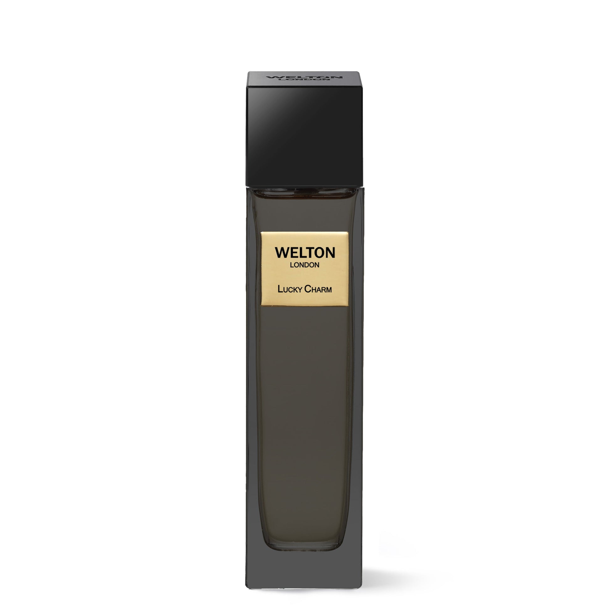 A tall, sleek black bottle with a gold “Lucky Charm EDP” label by Welton and a black square cap stands against a white background—an elegant luxury fragrance for lovers of sophisticated scents.