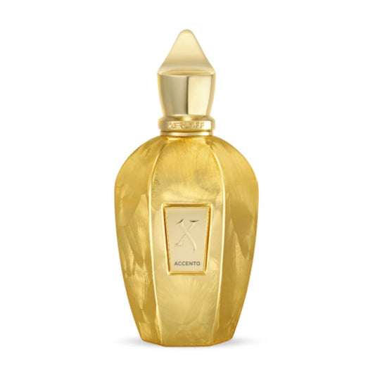 A luxurious, faceted golden bottle with a pointed cap, labeled ACCENTO, houses XERJOFF's Accento Overdose Eau de Parfum—a shiny, metallic design that reflects the elegance and allure of its floral aldehyde fragrance.
