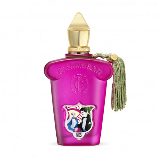 The Casamorati 1888 Gran Ballo Eau de Parfum by XERJOFF features a vibrant pink bottle with a gold cap, green tassel, and an illustrated vintage label—a delightful floral fruity fragrance.