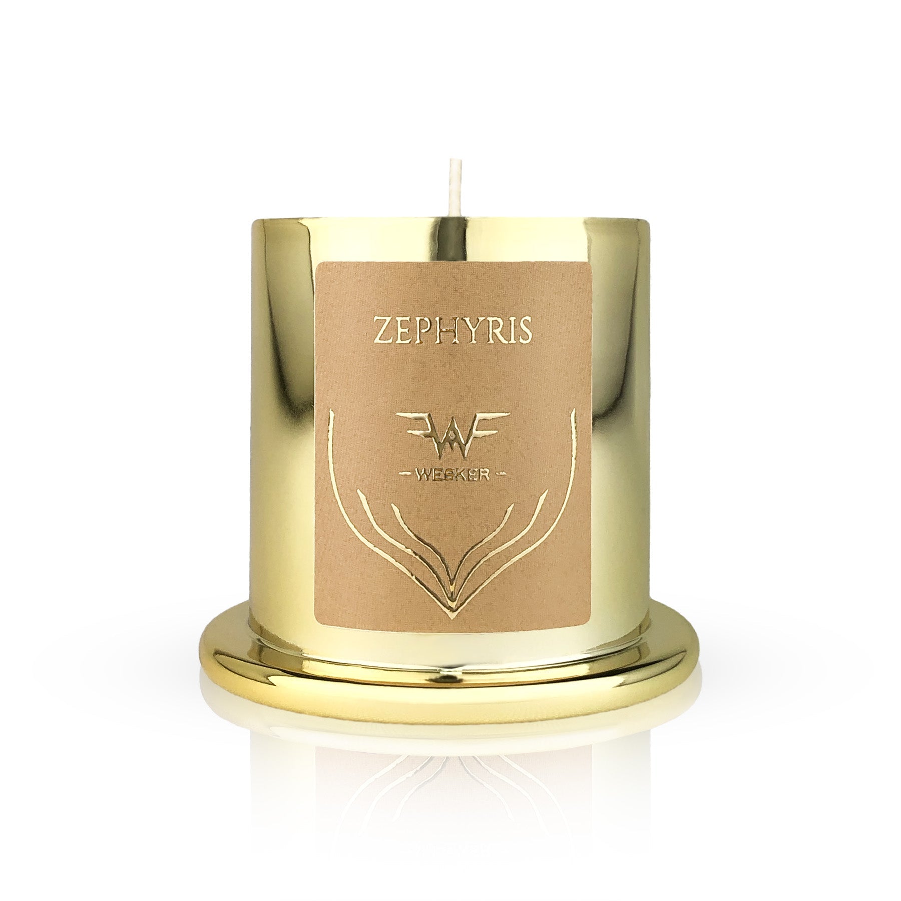 The Zephyris Candle by Wesker features a shiny gold holder with "Zephyris" and Wesker on its beige label, an embossed design, and a single wick. Inspired by Westwind, it sits on a matching gold base and evokes warm desert notes.