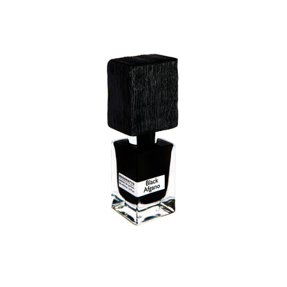 A clear glass bottle with a large textured black cap and label reading Black Afgano Extrait de Parfum by Fragrapedia Haus evokes bold hashish notes, set against a white background.