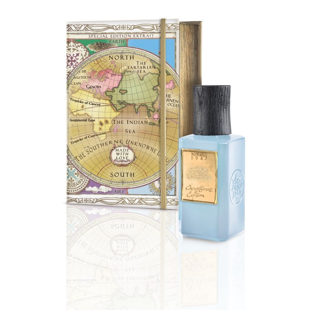 The CAFE CHANTANT EXCEPTIONAL EDITION EXTRAIT by Nobile 1942 features a blue bottle with a black cap and gold label, set before a decorative box with a vintage map—an evening scent ideal for lovers of powdery fragrances.