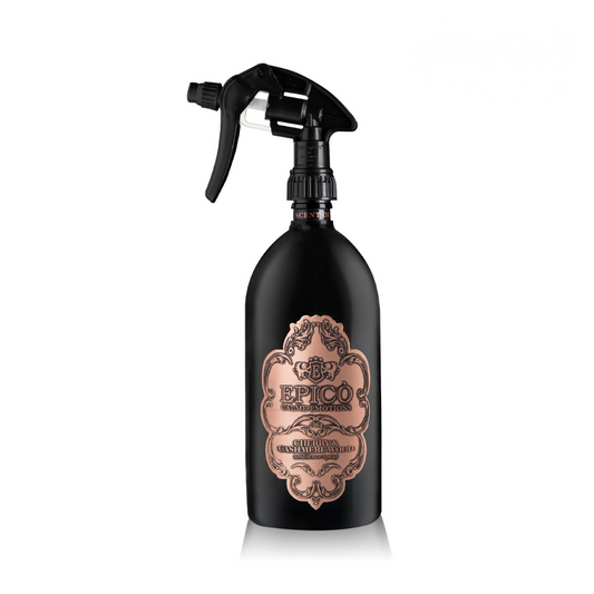 A black spray bottle labeled "Cherry & Cashmere Wood - Ambiance Spray" by EPICO sits against a white background—ideal for fabric, it features subtle musky perfume and vanilla notes for a luxurious touch.