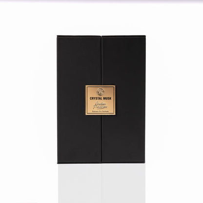 A black rectangular box with a gold label reading “Crystal Musk Eau de Parfum - Christian Provenzano” sits on a plain white background, suggesting musky amber and floral notes inside.