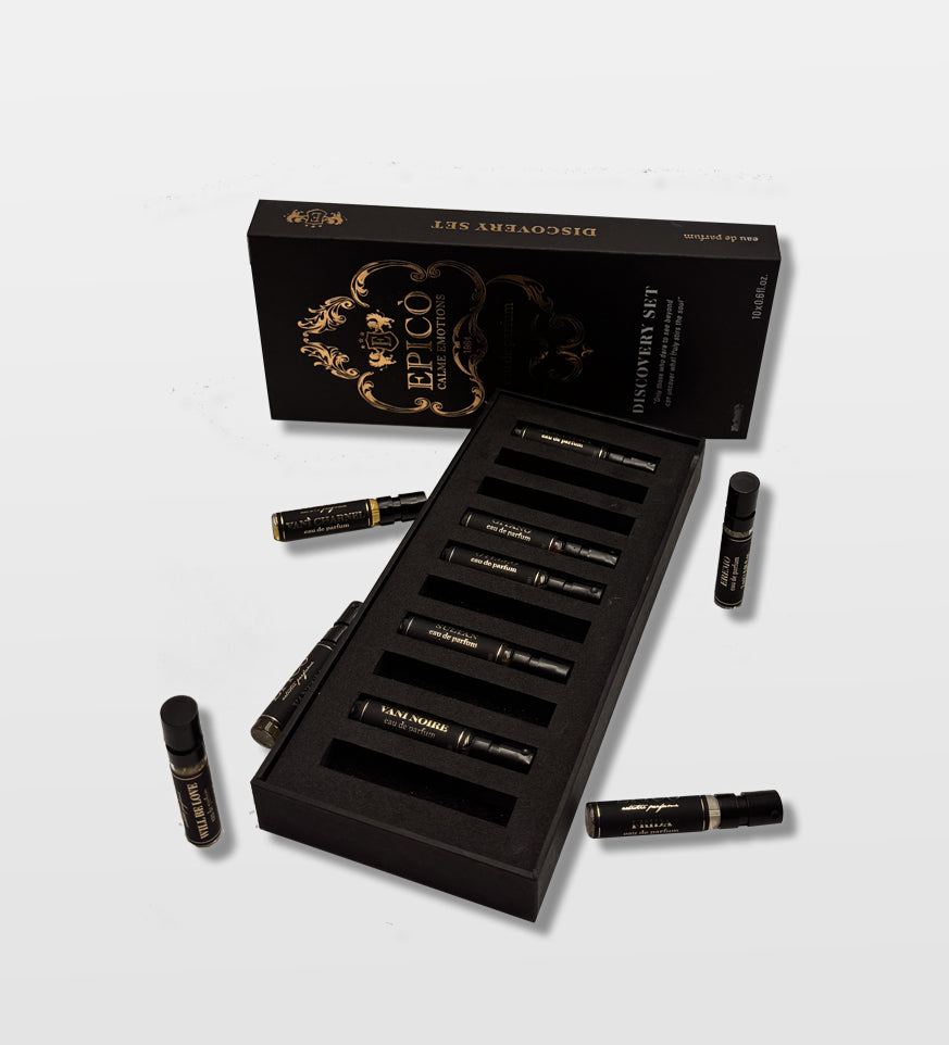 Black and gold cosmetic set with multiple bottles on a light gray Epico
background