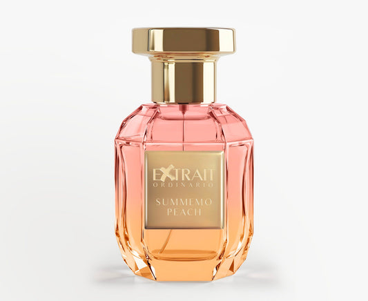 The faceted glass bottle with a gold cap holds Summemo Peach - Extrait Ordinario by Extrait Ordinario, its peach-toned fragrance captured in luxury. A gold plaque displays the name for an elegant summer touch.