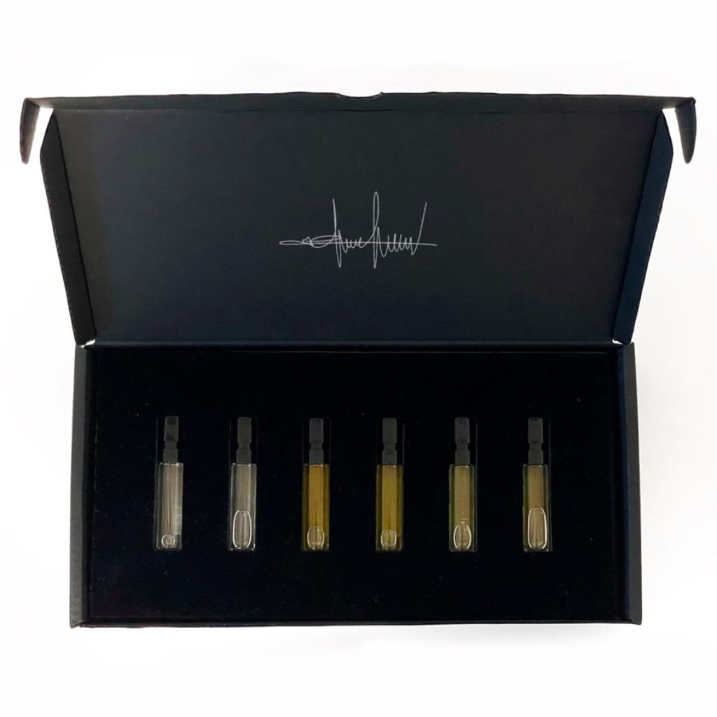The Filippo Sorcinelli Discovery Set 6 Perfumes (2024 release) features six glass vials of Extrait De Musique and Atmosphere D’Emotion in a black box with a signature-style logo inside the lid, arranged in a foam insert.