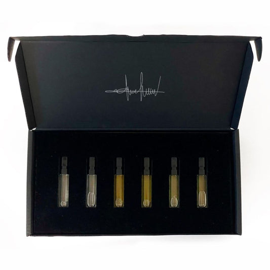 The Filippo Sorcinelli Discovery Set 6 Perfumes (2024 release) features six glass vials of Extrait De Musique and Atmosphere D’Emotion in a black box with a signature-style logo inside the lid, arranged in a foam insert.