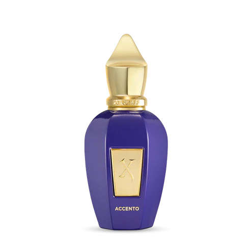 A purple bottle of Accento Eau de Parfum by Fragrapedia Haus, with gold accents, cap, and label bearing the logo and "ACCENTO," stands upright on a plain white background, suggesting its luxurious allure.