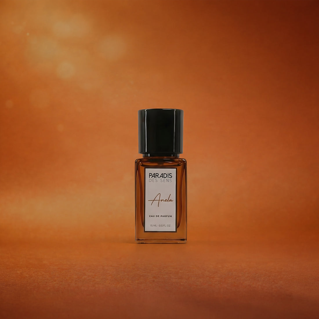 Perfume bottle labeled 'Paradis des Dies' on an orange background