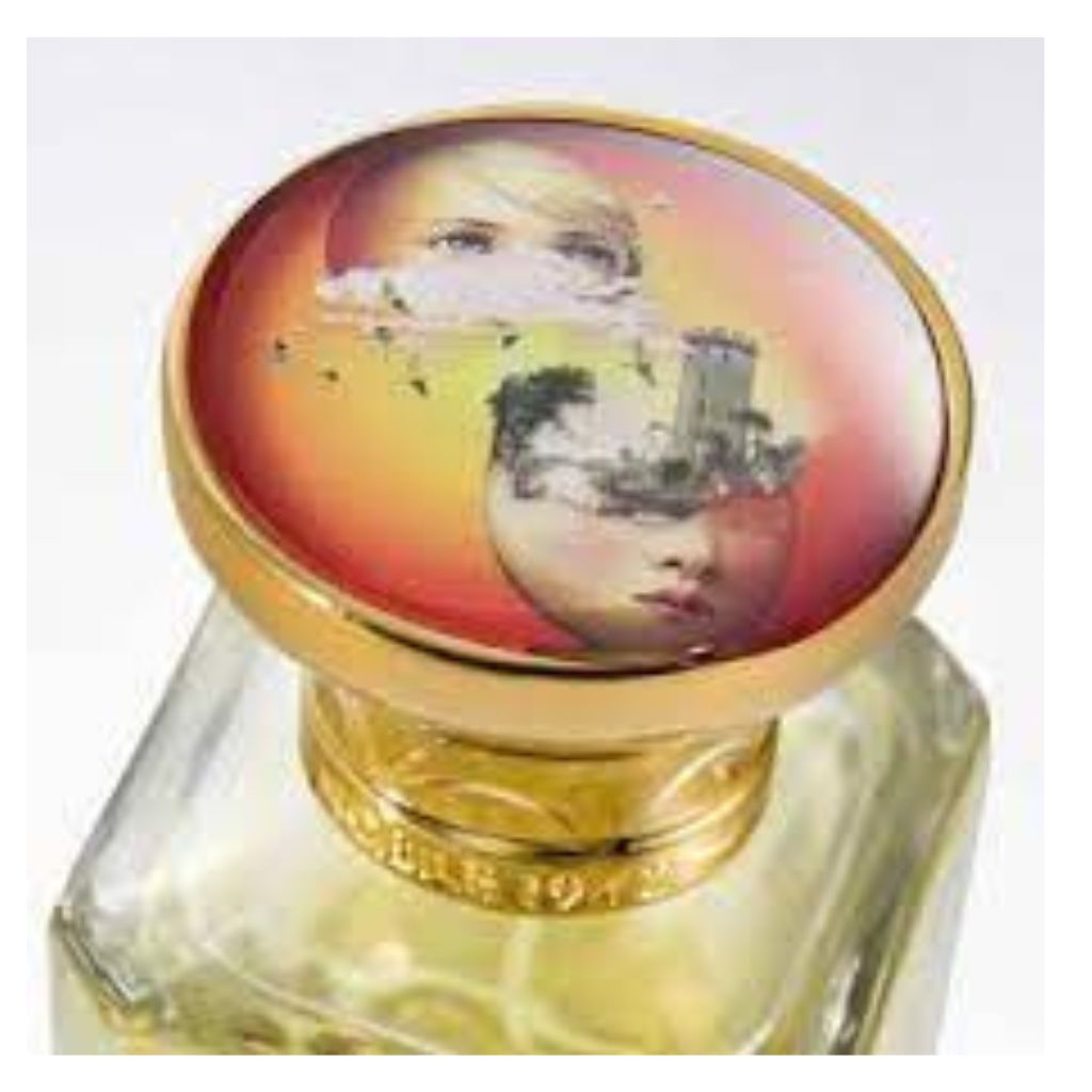LA STANZA DELLE BAMBOLE Eau de Parfum by Nobile 1942 comes in a bottle with a gold cap, featuring surreal art—a woman's face, cloud, birds, palm trees, and building on a warm sunset background—echoing the whimsy of childhood imagination.
