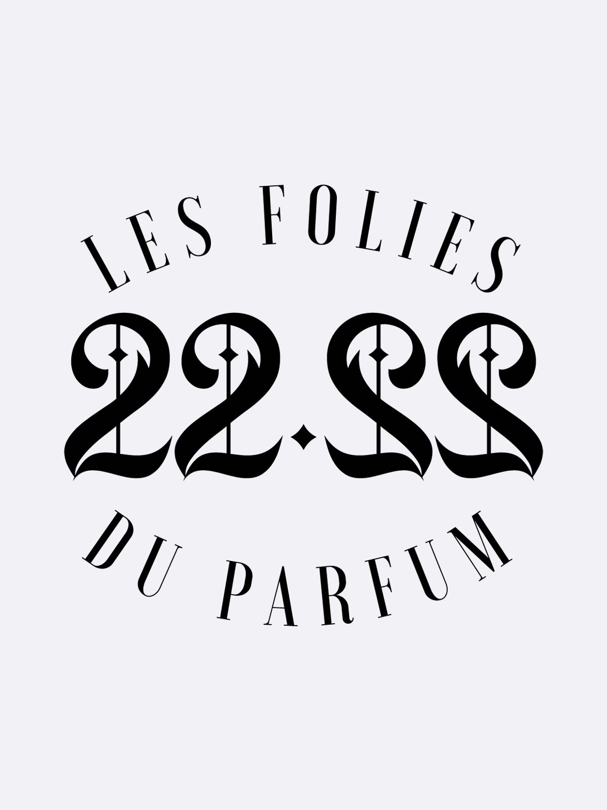 The image displays “22.22 - Les Folies du Parfum” in elegant serif and bold ornate fonts, centered on a light gray background—a nod to the artistic fragrances of Les Folies du Parfum.