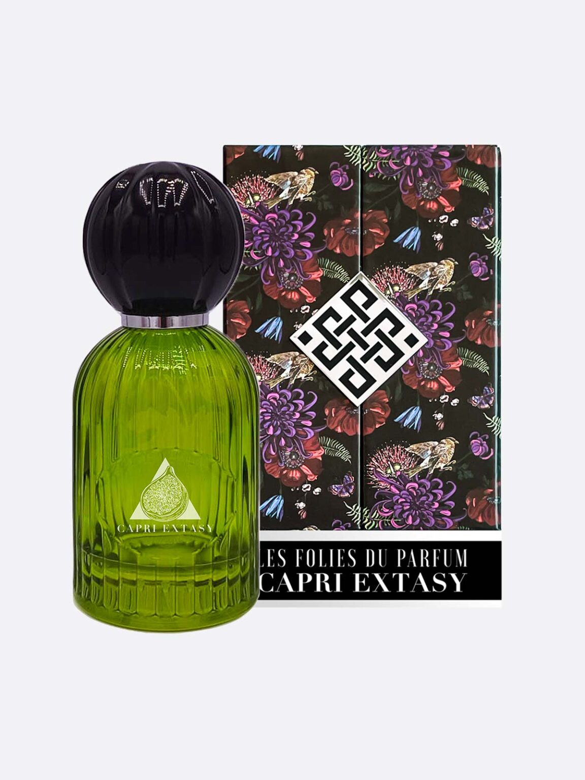 A green glass Capri Extasy - Les Folies du Parfum bottle sits before its box, decorated with vibrant flowers and butterflies on black, featuring the bold Les Folies du Parfum geometric logo.