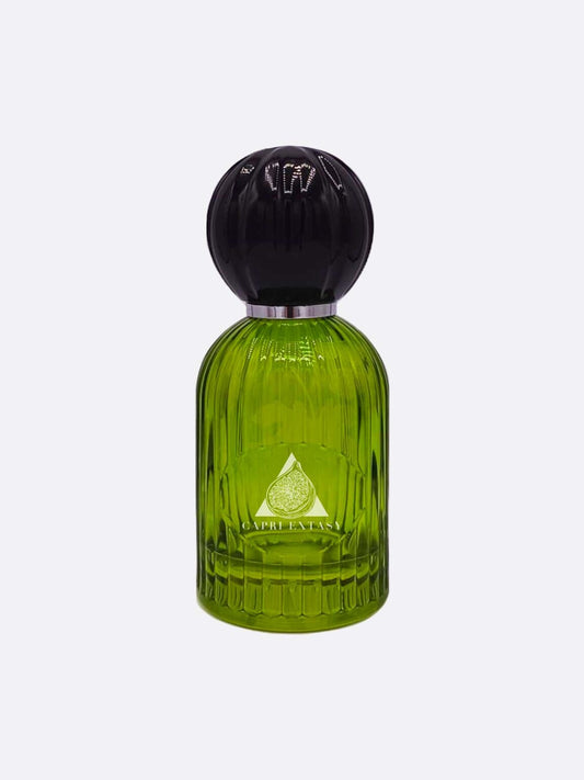 A green glass perfume bottle with vertical grooves, a round black cap, and silver band displays a fig illustration and "Capri Extasy" on the label. It's part of the Capri collection by Les Folies du Parfum.