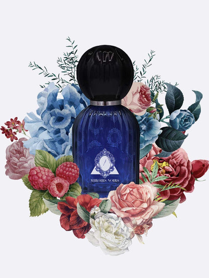 A dark blue Miroirs Noirs - Les Folies du Parfum bottle by Les Folies du Parfum, with a black round cap, is surrounded by vibrant flowers and raspberries on a light background, inspired by Countess Virginia Oldoini.