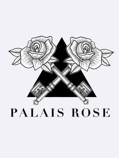 Two detailed roses cross stems above two ornate keys before a solid black triangle. Below, "Palais Rose - Les Folies du Parfum" is boldly inscribed, capturing the elegance of the Les Folies du Parfum brand and its timeless allure.