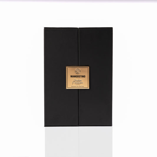 A sleek black rectangular gift box with a gold MANGOSTINO label sits on a white background, ideal for presenting Christian Provenzano’s Mangostino Eau de Parfum—an elegant unisex Oriental Woody fragrance.