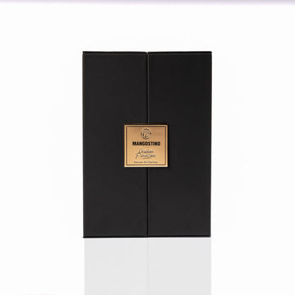 A sleek black rectangular gift box with a gold MANGOSTINO label sits on a white background, ideal for presenting Christian Provenzano’s Mangostino Eau de Parfum—an elegant unisex Oriental Woody fragrance.