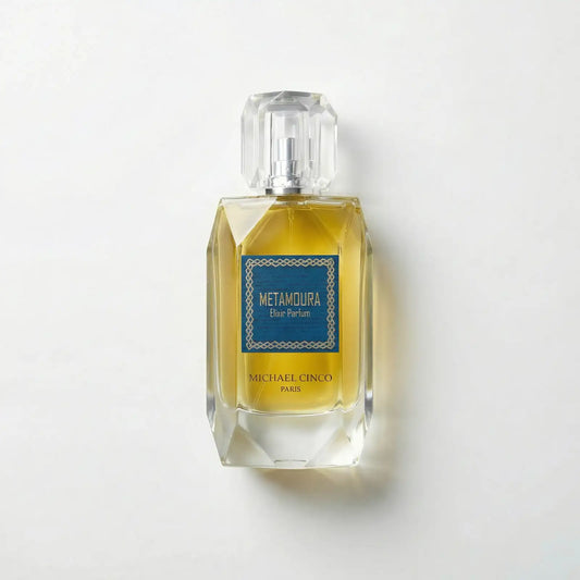 Michael Cinco Perfume bottle with 'Metamoura' label on a light gray background