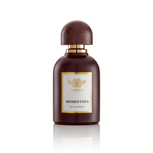 A dark brown perfume bottle with a rounded wooden cap and gold AMIRIUS PARIS label displays MOMENTOUS Eau de Parfum, a rose-scented fragrance, set against a white background.