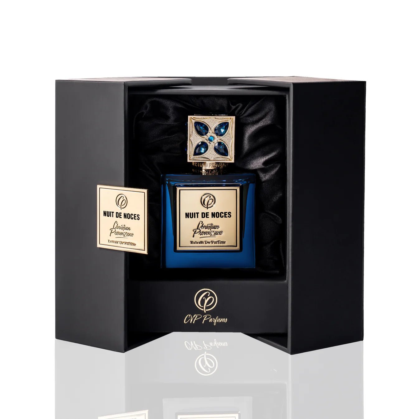Nuit De Noces Extrait De Parfum by Christian Provenzano Blue perfume bottle with gold and blue accents in a black box on a white background
