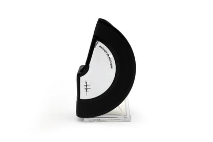'Filippo Sorcinelli Organ Series'A black and white curved perfume bottle with a clear glass base, standing upright on a white background.