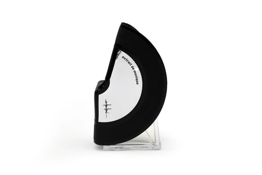 'Filippo Sorcinelli Organ Series'A black and white curved perfume bottle with a clear glass base, standing upright on a white background.