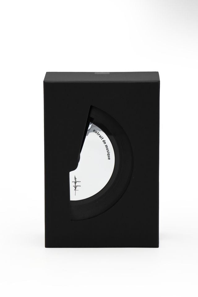 'Filippo Sorcinelli Organ Series 'Black and white perfume bottle with cap on a white background A minimalist black rectangular box with a large cutout on the front showing a white circular object inside, photographed against a clean white background.