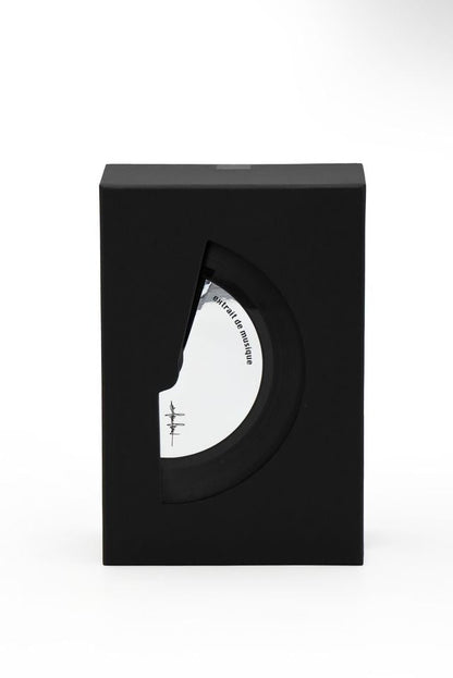 'Filippo Sorcinelli Organ Series 'Black and white perfume bottle with cap on a white background A minimalist black rectangular box with a large cutout on the front showing a white circular object inside, photographed against a clean white background.