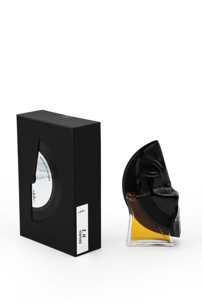 'Filippo Sorcinelli Organ #7'Black and white perfume bottle with cap on a white background