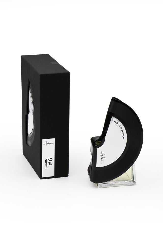 'Filippo Sorcinelli Organ #6'Black and white perfume bottle with cap on a white background
