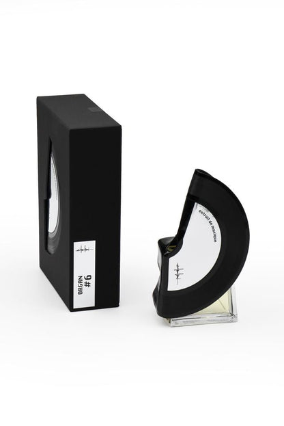 'Filippo Sorcinelli Organ #6'Black and white perfume bottle with cap on a white background