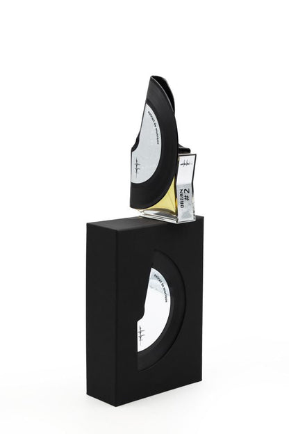 'Filippo Sorcinelli Organ #2'Black rectangular box with a glass container holding a small bottle of perfume on a white background