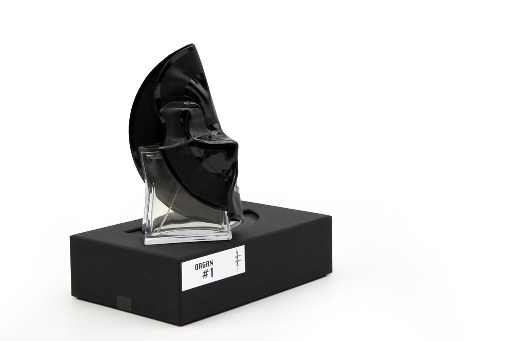 'Filippo Sorcinelli Organ #1'Black and clear sculpture on a black base with a white label against a white background