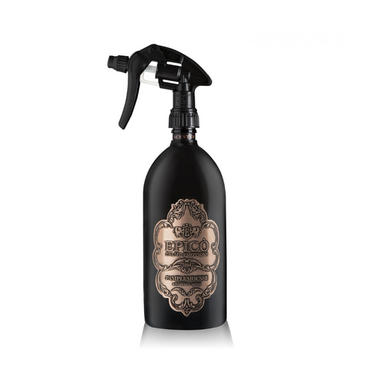 A black spray bottle with a gold EPICO label, Pamplemousse - Ambiance Spray by EPICO features vintage-style details and an aromatic, elegant grapefruit-inspired fragrance. Comes with a trigger spray nozzle for easy use.