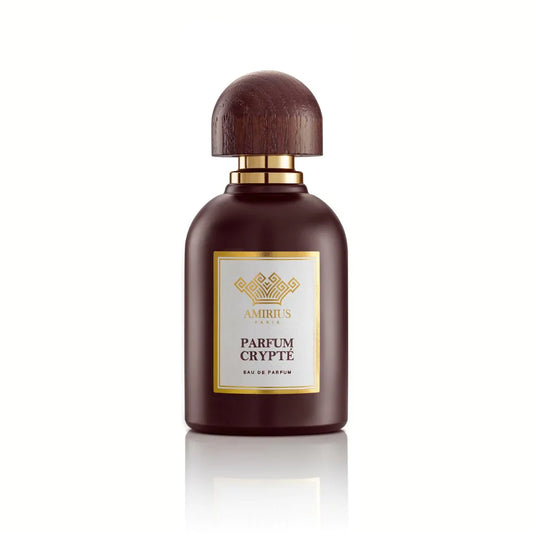 A dark brown PARFUM CRYPT Eau de Parfum bottle from AMIRIUS PARIS, featuring a wooden cap, gold accents, and a square gold label, stands out as a striking summer fragrance against a white background.