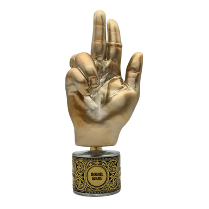 A gold hand statue with a gesture, mounted on an ornate circular base reading PONT. MAX. Eau de Parfum by Filippo Sorcinelli, featuring decorative patterns evoking resin incense and amber tones.