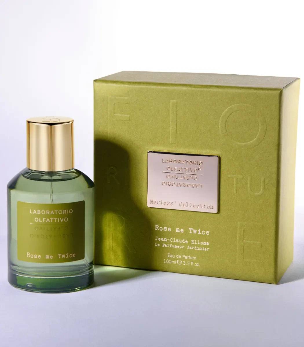 Perfume bottle and packaging with ''Rose me Twice Laboratorio Olfattivo' branding on a light gray background