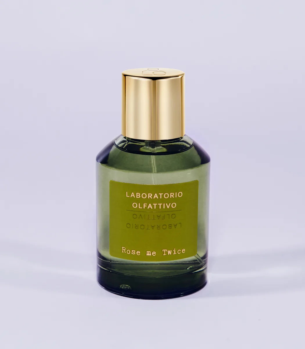 'Rose me Twice Laboratorio Olfattivo'Perfume bottle with gold cap and green label on a light gray background