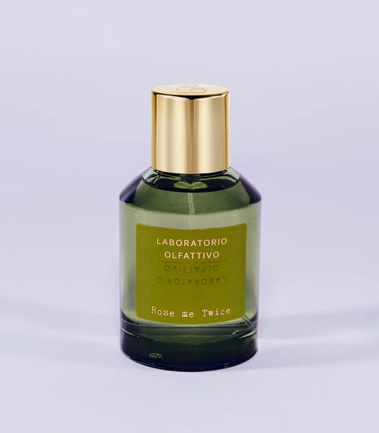 'Rose me Twice Laboratorio Olfattivo'Perfume bottle with gold cap and green label on a light gray background