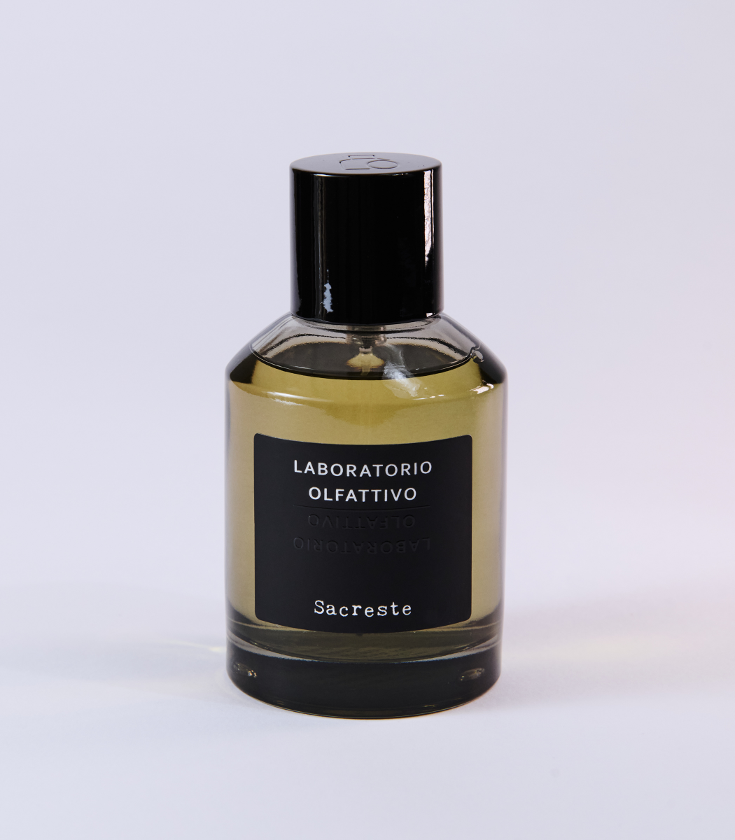 A bottle of Sacreste - Laboratorio Olfattivo by Laboratorio Olfattivo, designed by Luca Maffei, with a black cap and dark label set against a light background.